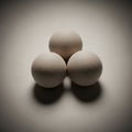 The spheres have a textured finish, casting soft shadows in the subdued Royalty Free Stock Photo