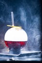 Spherical glass with smoke and alcohol. Caramelized Lemon Slices. Smoke on a black background Royalty Free Stock Photo