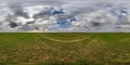 spherical 360 hdri panorama among green grass farming field with clouds on overcast sky in equirectangular seamless projection, Royalty Free Stock Photo