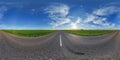 spherical 360 hdri panorama on old asphalt road with cracks with clouds and sun on blue sky in equirectangular seamless projection Royalty Free Stock Photo