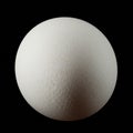 A spherical object resembling a white eggshell is centered against a black Royalty Free Stock Photo