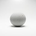 A spherical object with a textured surface. It has a light gray color and appears to be Royalty Free Stock Photo