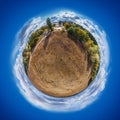 Spherical panorama of dry weedy field in a shape of the globe