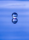 Spherical water droplet reflected Royalty Free Stock Photo