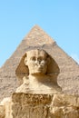 Sphinx on the background of great pyramid Royalty Free Stock Photo