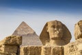 Sphinx in front of the Cheops pyramid, Giza, Egypt Royalty Free Stock Photo