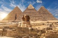 The Sphinx and The Great Pyramids of Giza near the ruins of a temple in Giza, Egypt Royalty Free Stock Photo