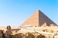 Sphinx and Khufu pyramid Royalty Free Stock Photo