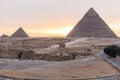 The Sphinx, the Pyramid Of Khafre and the Pyramid of Menkaure in Giza at sunset, Egypt