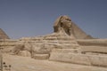 Sphinx with pyramids in the background