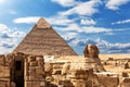 The Sphinx, the Temple and the Pyramid of Chephren under the clouds in Giza Royalty Free Stock Photo