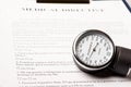 Sphygmomanometer on medical directive document Royalty Free Stock Photo