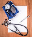 Sphygmomanometer, stethoscope, paper Royalty Free Stock Photo