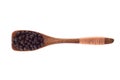 Spice Black pepper grains in wooden spoon isolated on a white b Royalty Free Stock Photo