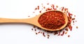 Spice Chili Flake In Wooden Spoon On White Background. Top View Of Red Pepper Pile, Spicy Dry Seasoning. AI generated Royalty Free Stock Photo
