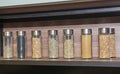 Spice jars on a shelf in domestic kitchen