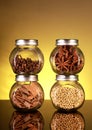 Spice Jars with Star Anise, Cloves, Cinnamon, Coriander Seeds Royalty Free Stock Photo