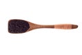 Spice Nigella or Black cumin seeds in wooden spoon isolated on