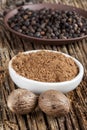 Spice nutmeg in whole and ground Royalty Free Stock Photo