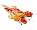 Spice. Various spices in wooden spoons over white. Curry, saffron, turmeric, cinnamon Royalty Free Stock Photo