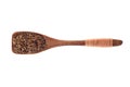 Spice zira black in wooden spoon isolated on a white background