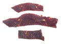 Spiced beef jerky slices isolated on white background, top view Royalty Free Stock Photo