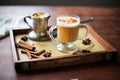 spiced chai on a wooden tray with a book and glasses