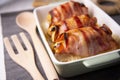 Spiced chicken rolled with bacon cooked in the oven.