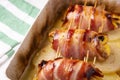 Spiced chicken rolled with bacon cooked in the oven.