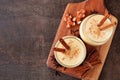 Spiced Christmas eggnog. Sserving board from above with copy space on a dark background. Royalty Free Stock Photo