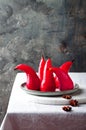 Spiced hibiscus or red wine poached pears. Delicious winter french dessert.