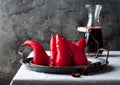 Spiced hibiscus or red wine poached pears. Delicious winter french dessert.