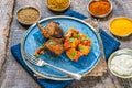 Spiced lamb cutlets with Bombay aloo