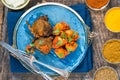 Spiced lamb cutlets with Bombay aloo