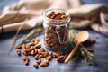 spiced nuts in a jar on a burlap cloth