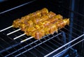 Spiced pork meat skewers just before baking on oven