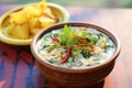 spiced potato raita with whole green chilis garnish Royalty Free Stock Photo