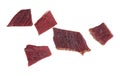 Spices beef jerky pieces isolated on white background, top view. Dried meat Royalty Free Stock Photo