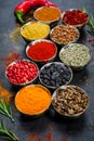Spices. Colorful spices. Curry, Saffron, turmeric, cinnamon and otheron a dark concrete background. Pepper. Large collection of di Royalty Free Stock Photo