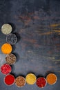 Spices. Colorful spices. Curry, Saffron, turmeric, cinnamon and otheron a dark concrete background. Pepper. Large collection of di Royalty Free Stock Photo