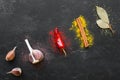 Spices and condiments with herbs on a black background Royalty Free Stock Photo