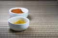 Spices in cups on a mat background Royalty Free Stock Photo