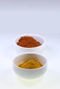 Spices in cups on a white background