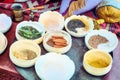 Spices in half-empty bowls for sale on the market. Trade of spices at the Bazaar. A Muslim spice merchant`s shop Royalty Free Stock Photo