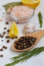 Spices and herbs. close-up mix of peppers in a wooden spoon and Pink Himalayan salt Royalty Free Stock Photo