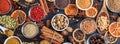 Spices and herbs. Colorful spices flat lay on wooden table Royalty Free Stock Photo