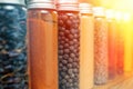 Spices and herbs of different colors in small jars. Selective soft focus Royalty Free Stock Photo