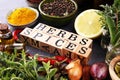 Spices and herbs on table. Food and cuisine ingredients with pepper and spices herbs sign with wooden cubes