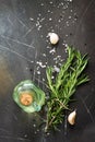 Spices, olive oil and herbs on a dark stone or slate table. Ingredients for cooking. Royalty Free Stock Photo