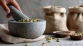 Spices in Rustic Kitchen Hand Grinding Cardamom in Stone Mortar for Royalty Free Stock Photo